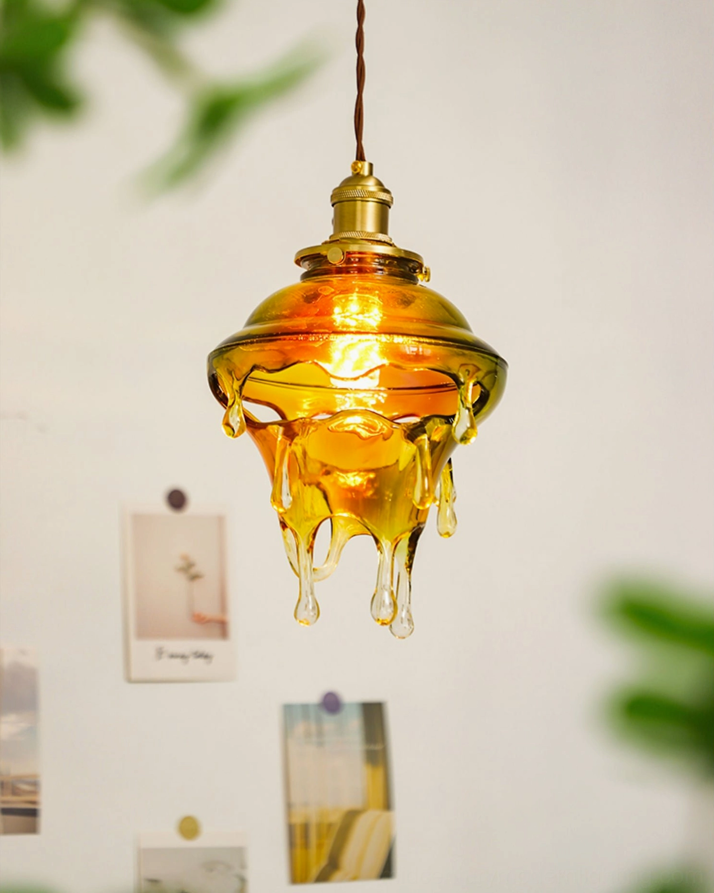 Warm brass and resin pendant fixture demonstrating craftsmanship and mid-century modern design