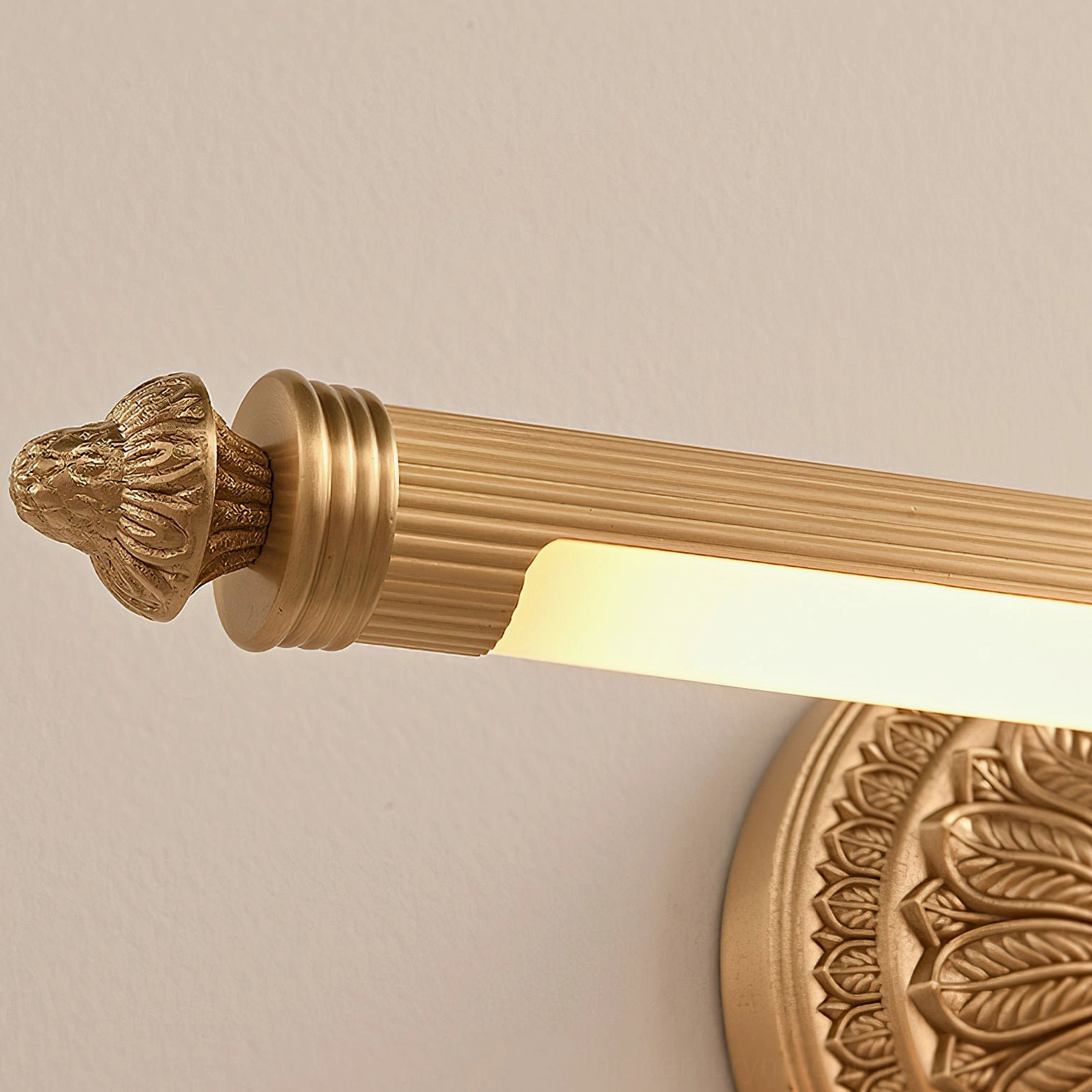 Ellesmere brass wall sconce backplate detail showcasing deeply etched floral botanical motif