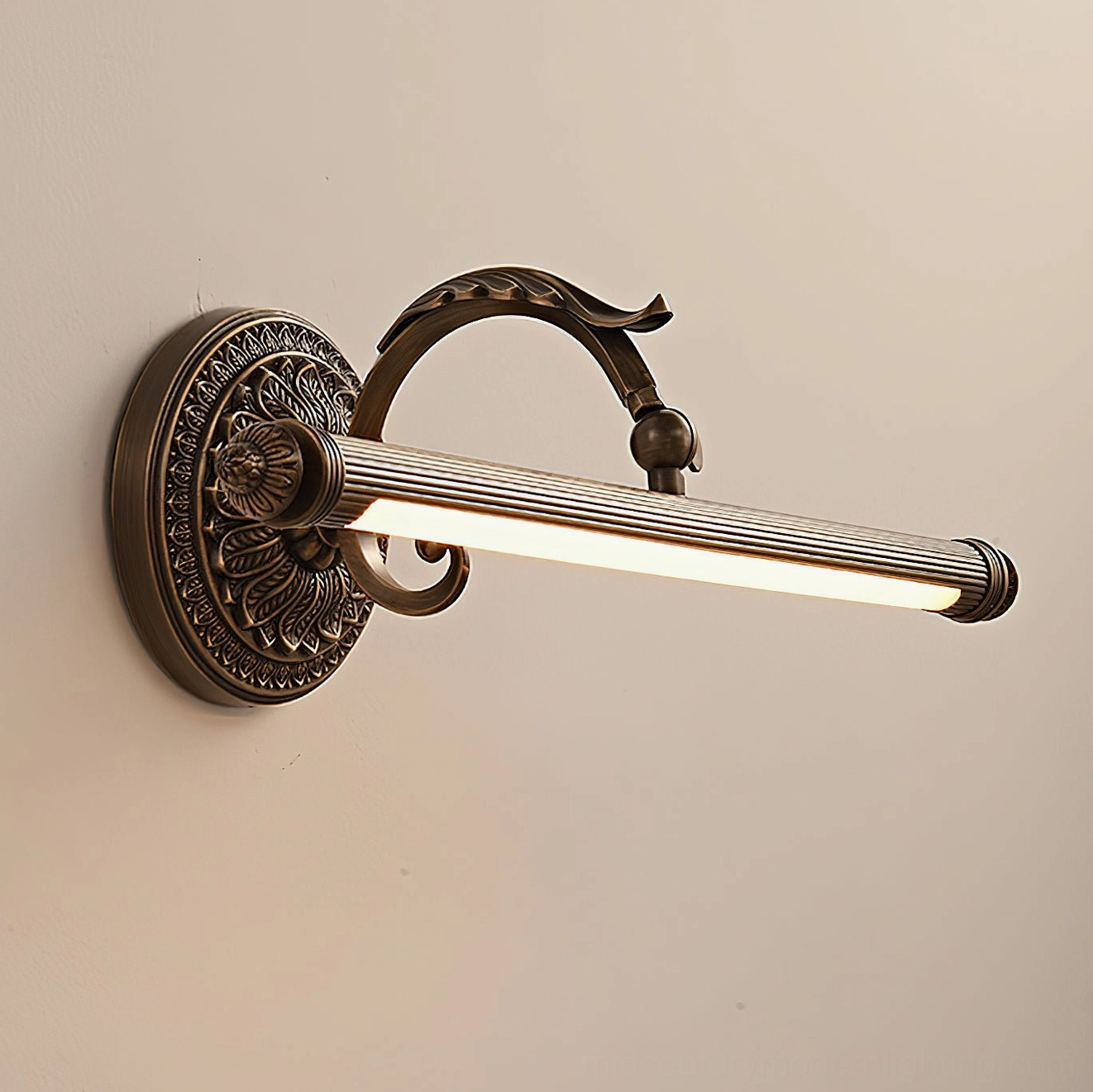 Brass wall sconce close-up showing reeded texture bar and classical turned finials detail