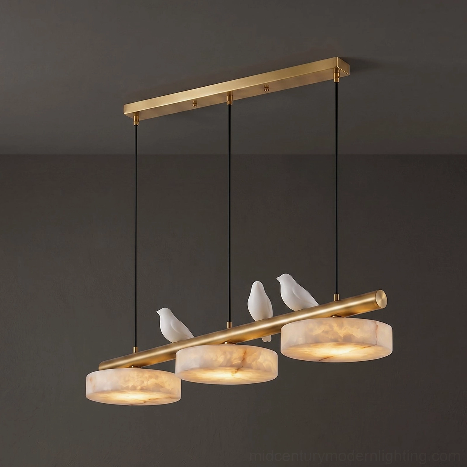 Brass finish linear alabaster chandelier with three bird figurines and circular stone shades