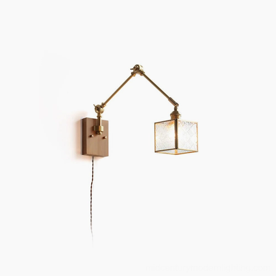 Dual-arm mid-century modern swing wall lamp with brass hardware and ribbed glass shade, front studio view