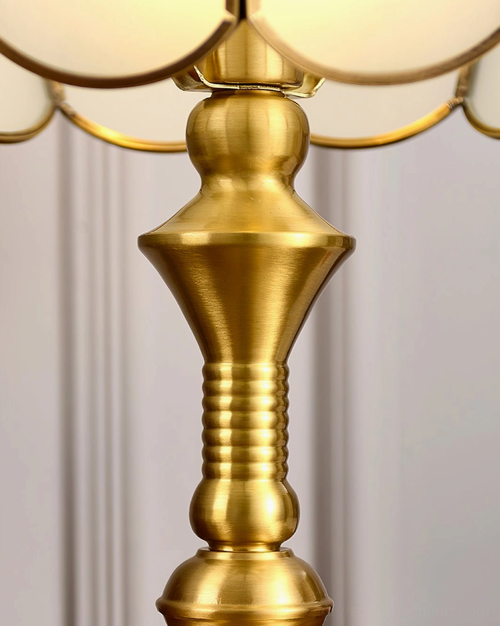 Close-up of brass table lamp base showing quality brass construction and patina development