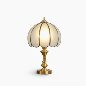 Vintage brass table lamp with ribbed frosted glass shade, front view on white background showing mid-century modern design