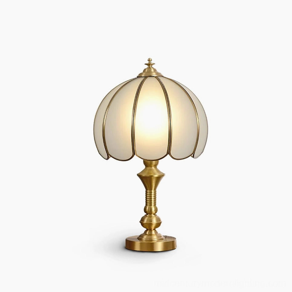 Vintage brass table lamp with ribbed frosted glass shade, front view on white background showing mid-century modern design