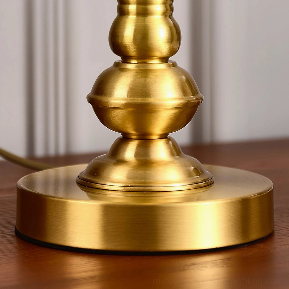 Brass table lamp in living room corner creating focal point with warm ambient light
