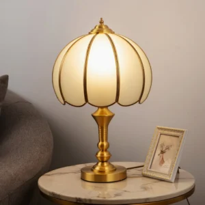 Brass table lamp placed on marble side table in warm vintage interior, eye-level perspective with warm ambient lighting