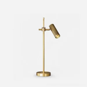 Polished brass adjustable task table lamp with ribbed metal shade and sculptural base, front studio view showcasing mid-century modern design