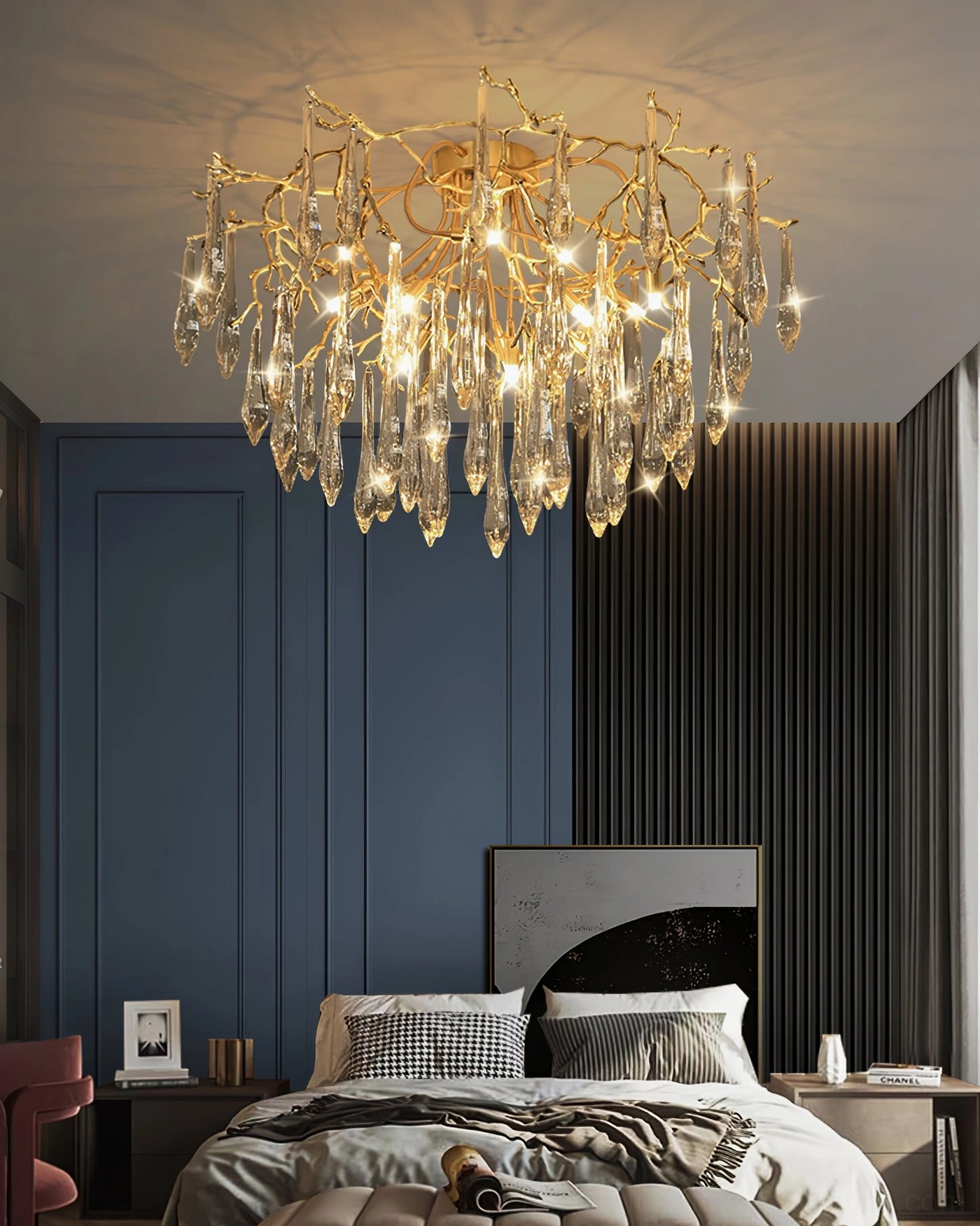 Brass teardrop ceiling fixture in modern bedroom with blue accent wall, luxury crystal chandelier style