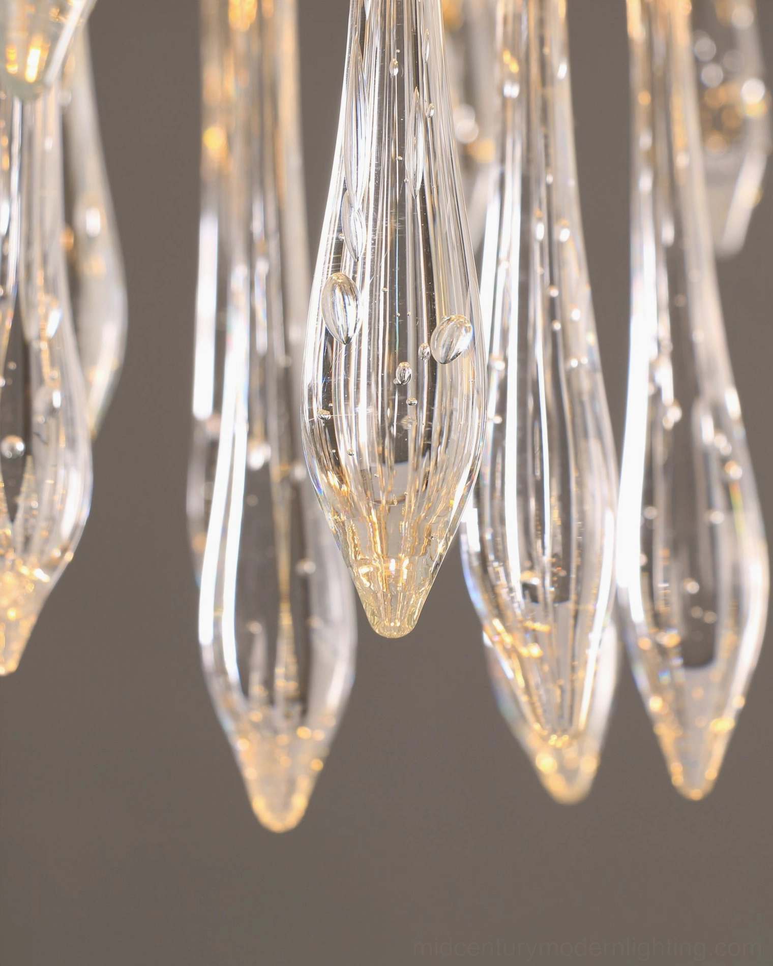 Brass teardrop ceiling lamp showing construction details and crystal glass assembly
