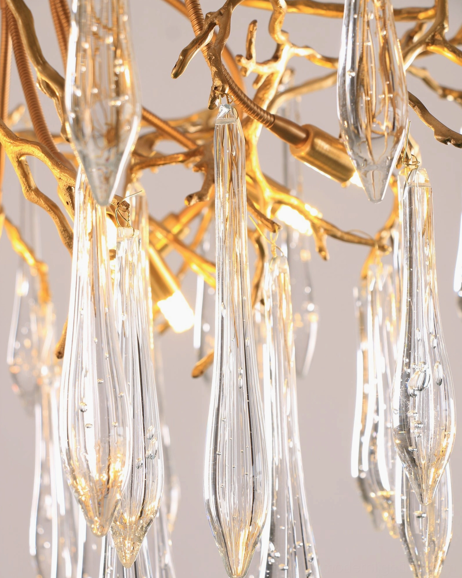 Brass teardrop ceiling pendant lamp, sculptural design detail photography
