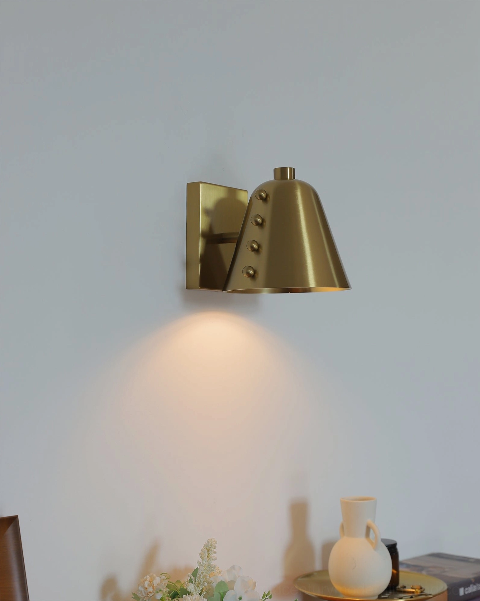 Brass wall lamp front side view home decor conical shade upward warm wall glow aesthetic