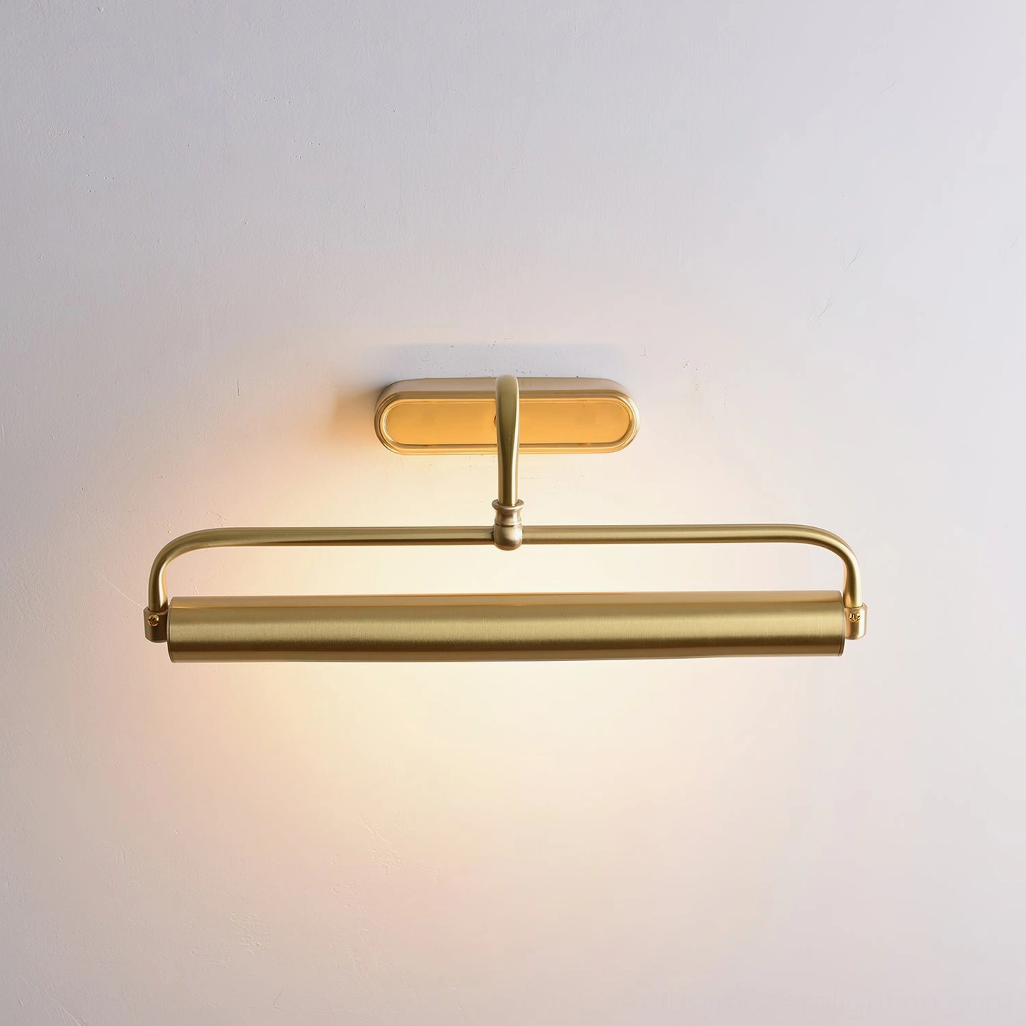 Brass wall sconce with integrated LED warm light compact minimalist design, front view