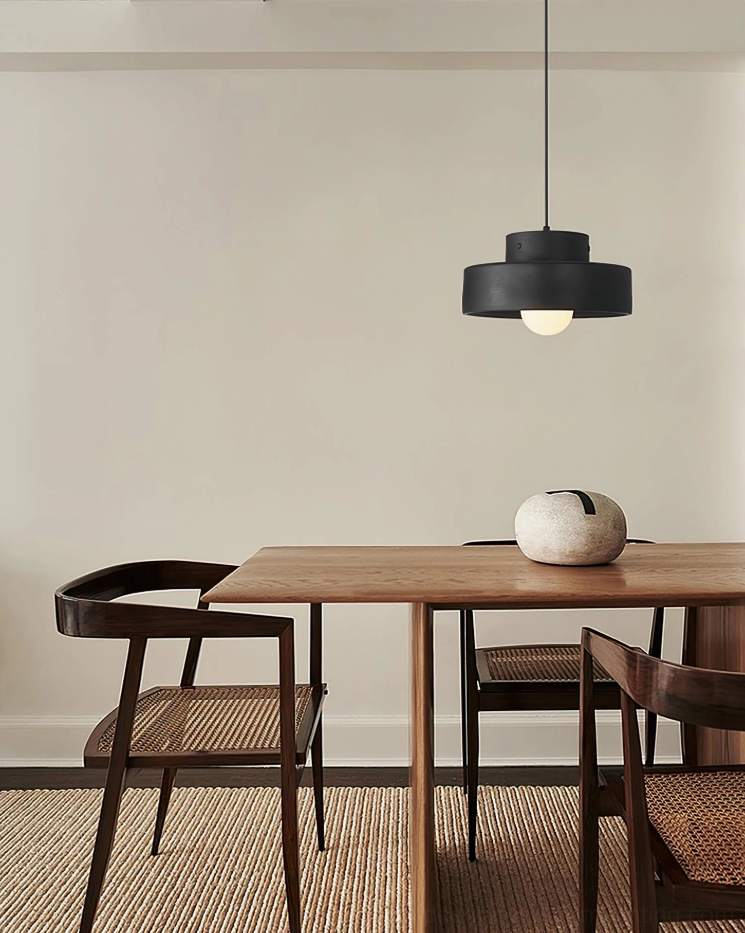Bray black pendant lamp wooden dining area warm neutral interior eye-level view
