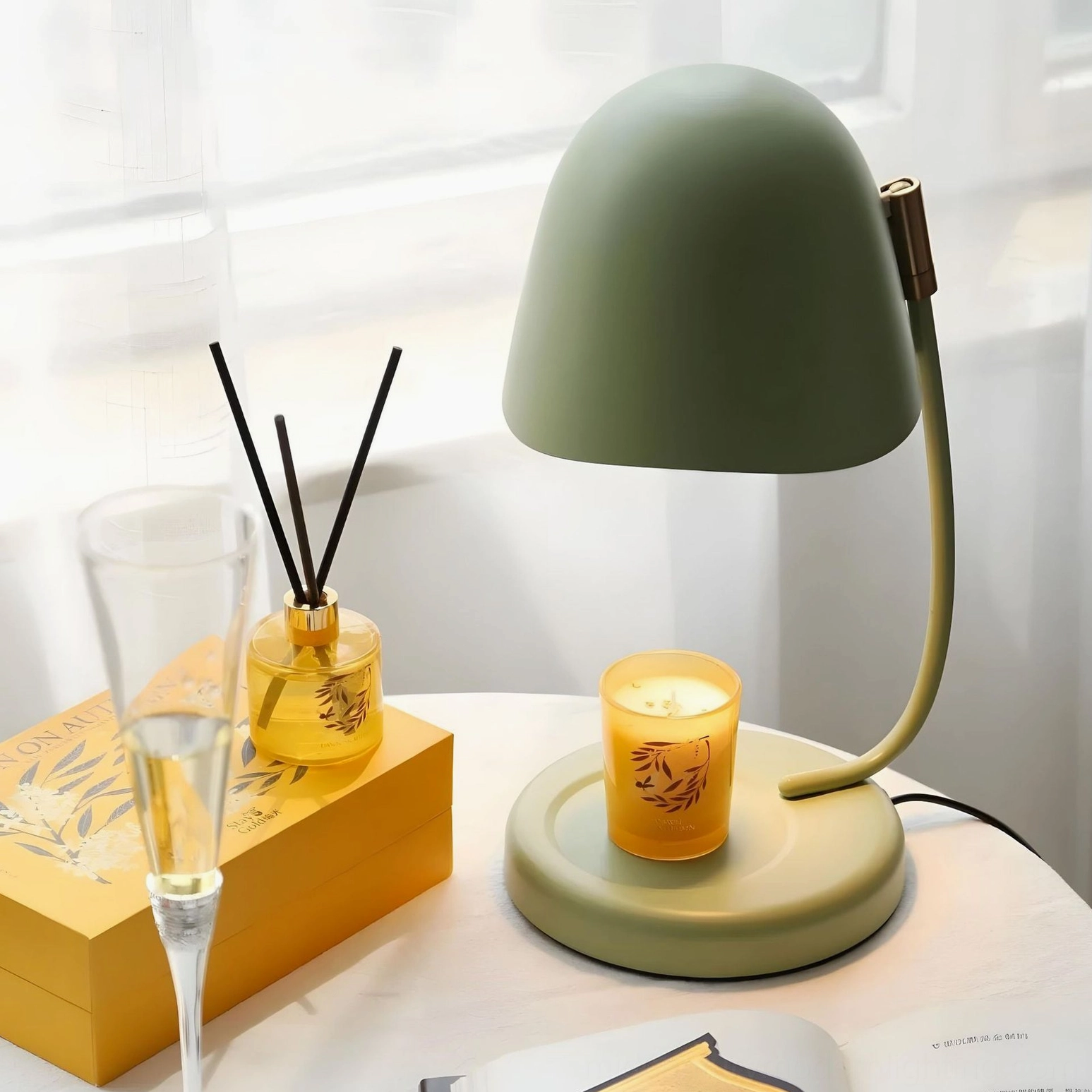 Sage green Breez table lamp by sunny window with champagne flute and home fragrance diffuser dining room styling