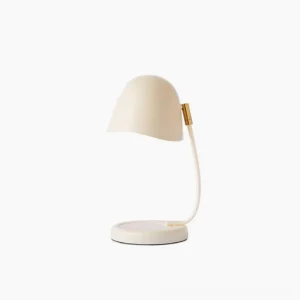 Breez candle warming table lamp with curved metal shade in minimalist modern design, studio front view