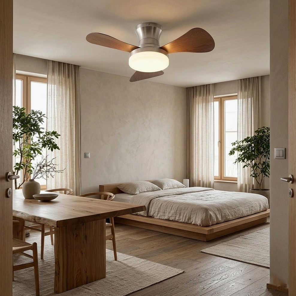 Brennan low-profile ceiling fan light in minimalist master bedroom with natural wood furniture and green plants