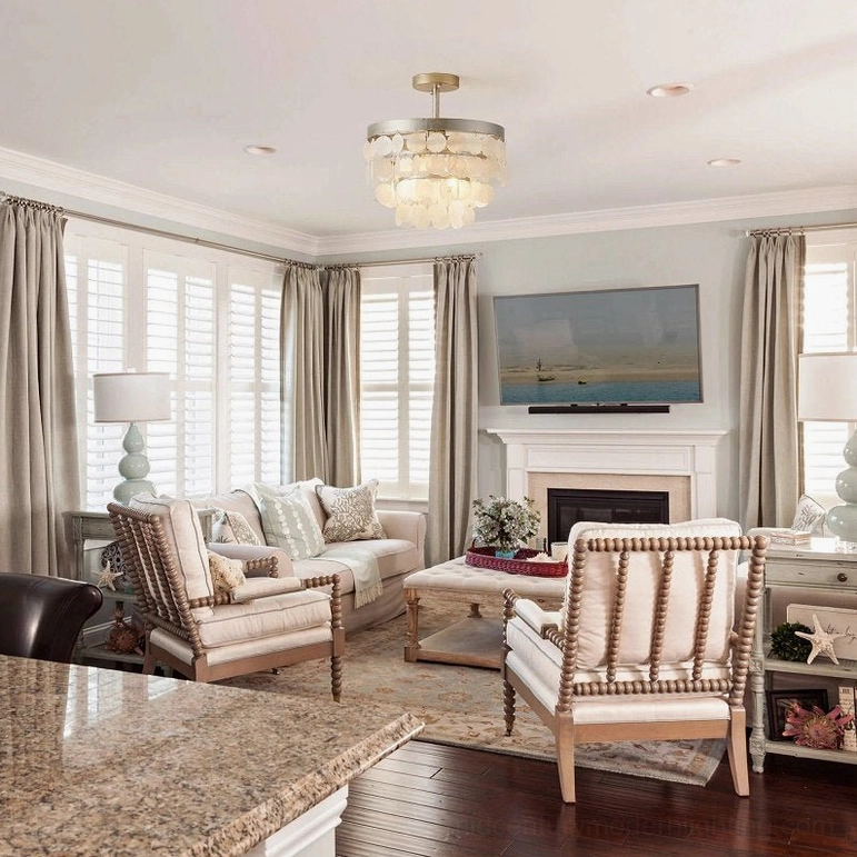 Capiz shell ceiling fixture in family room with fireplace and warm neutral American traditional home styling