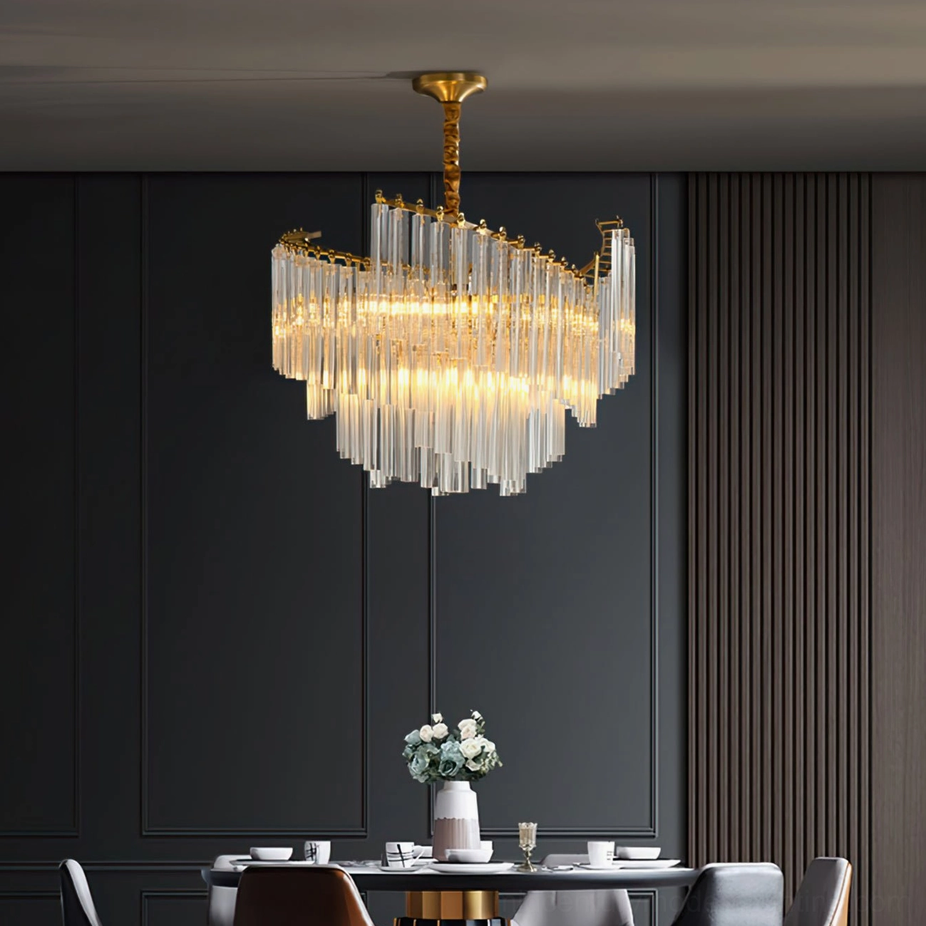Brinicle tiered crystal chandelier in interior setting with ambient room lighting