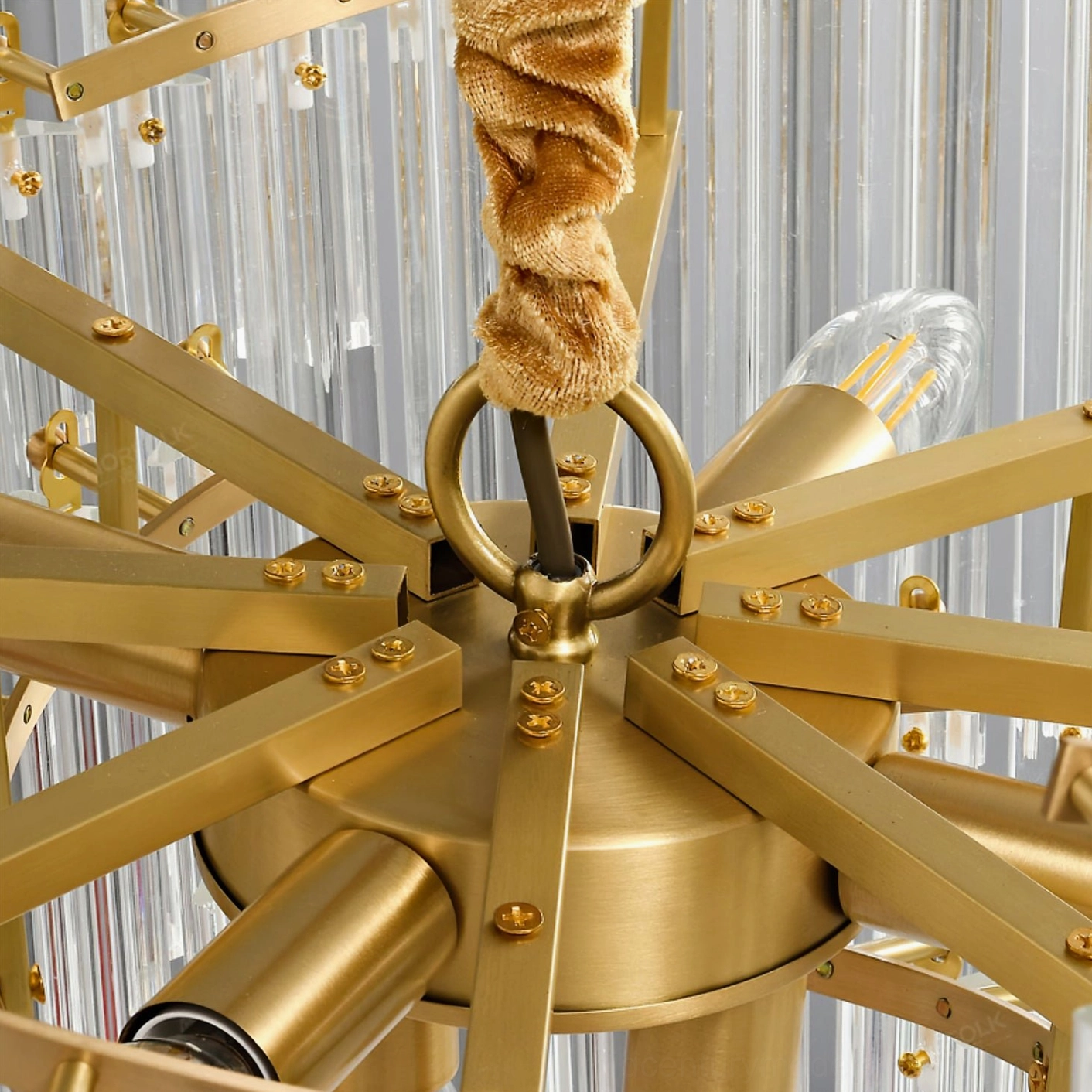 Brinicle tiered crystal chandelier showing multi-layer crystal rod design and brass suspension