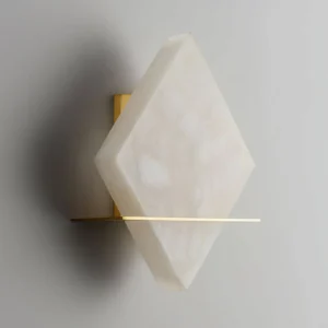 Brockton Alabaster Wall Lamp side close-up detail, unlit alabaster texture with brass mounting hardware