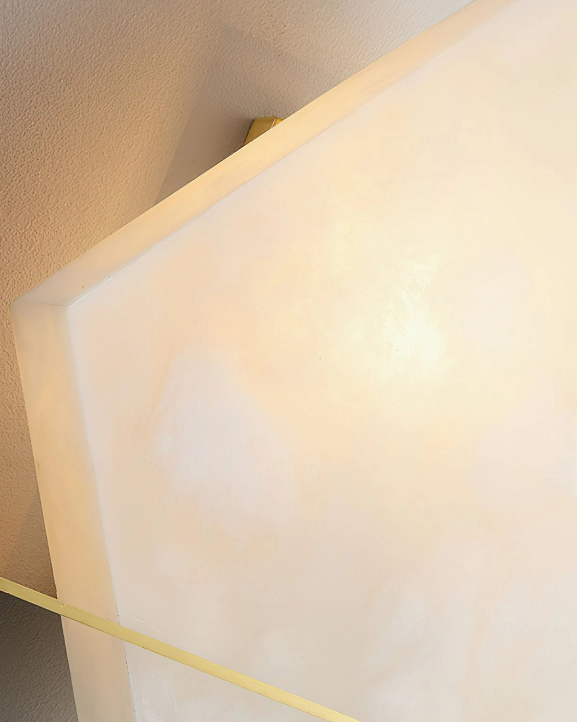 Brockton Alabaster Wall Lamp extreme close-up, translucent alabaster veining and texture detail with warm light