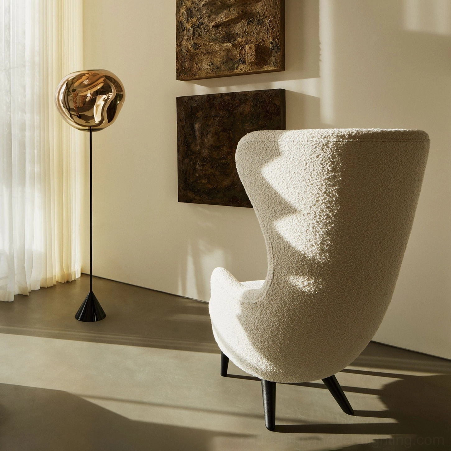 Bronze Lava Slim Floor Lamp in quiet living corner with boucle armchair, contemporary sculptural floor lighting