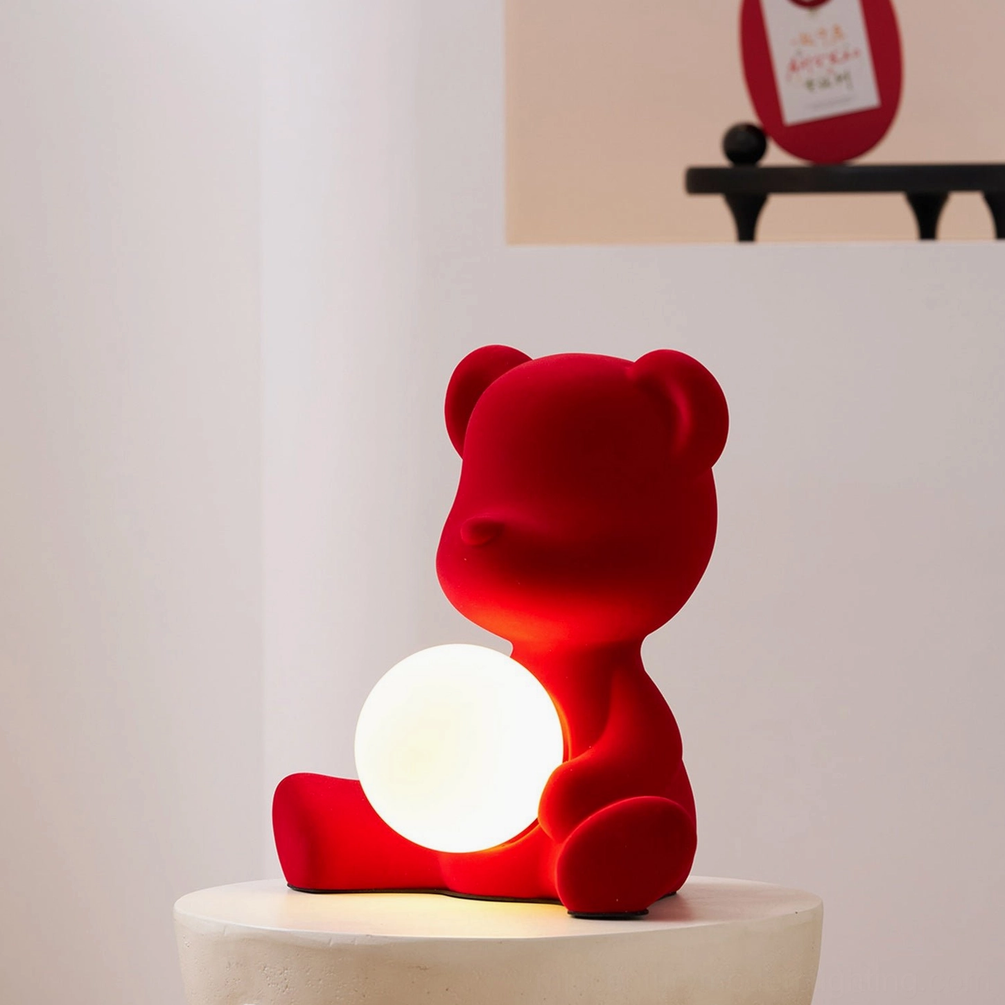 Brown teddy bear table lamp on surface with artistic lighting showcase