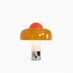 Brumbry mushroom table lamp with amber orange glass shade and polished chrome base, front view on white background