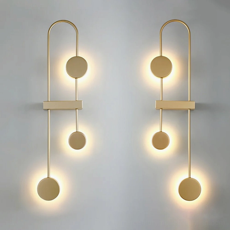 Brushed gold geometric wall sconce with vertical stacked pendant configuration and LED illumination