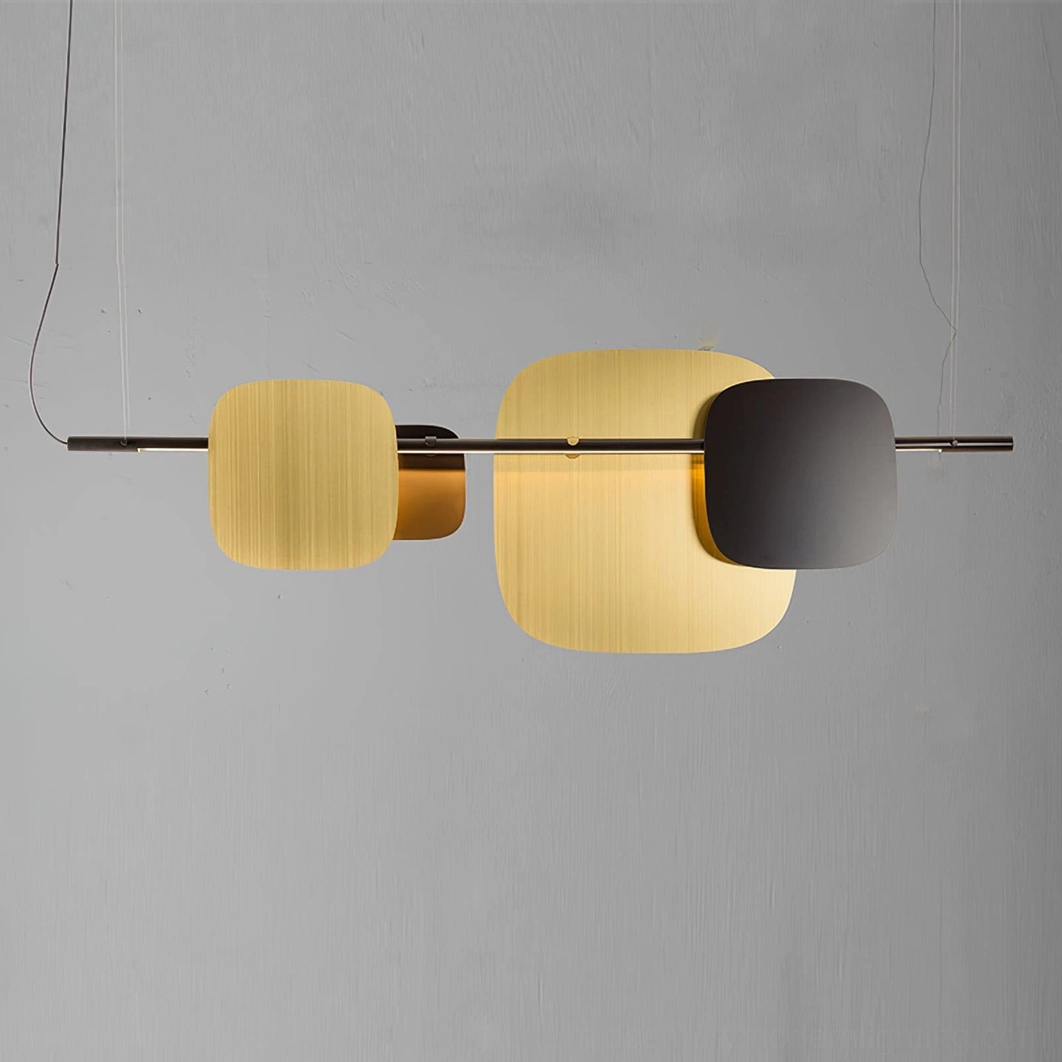 Brushed gold modern pendant light on light background, elegant geometric chandelier design
