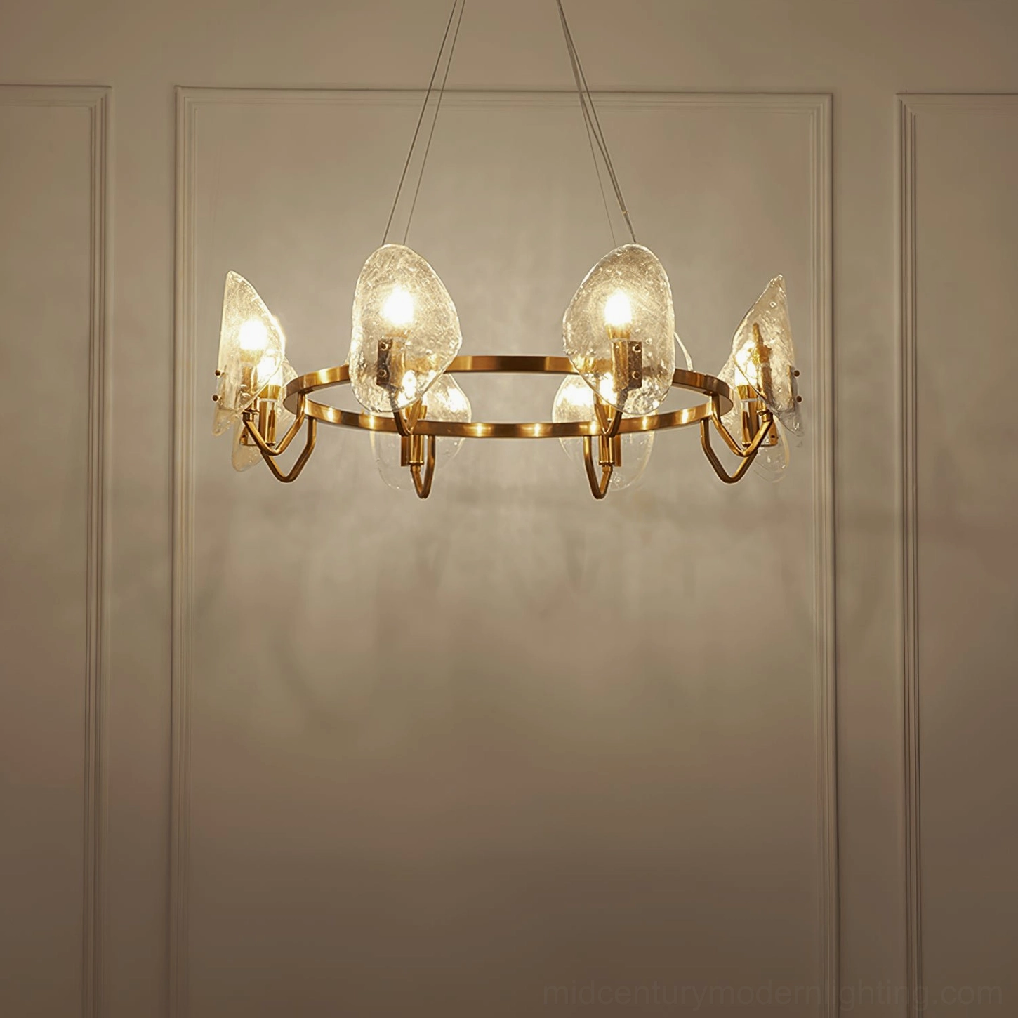 Mid-century modern bubble glass chandelier with warm candle-style bulbs illuminated in contemporary interior