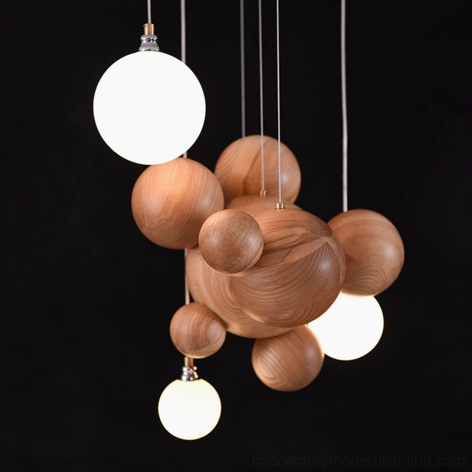Close-up view of wooden sphere cluster with illuminated glass diffusers showing detailed craftsmanship and natural wood grain