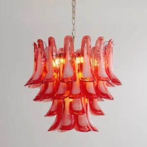 Illuminated Buena Murano glass chandelier showing layered petal structure and warm glowing light from 10 bulbs