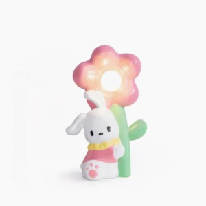 Whimsical Bunny Flower Table Lamp front view with pastel pink and green ceramic design on white background