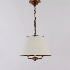Mid-century modern Burdett pendant light fixture with bronze chain and off-white tapered shade, direct frontal view against neutral gray background