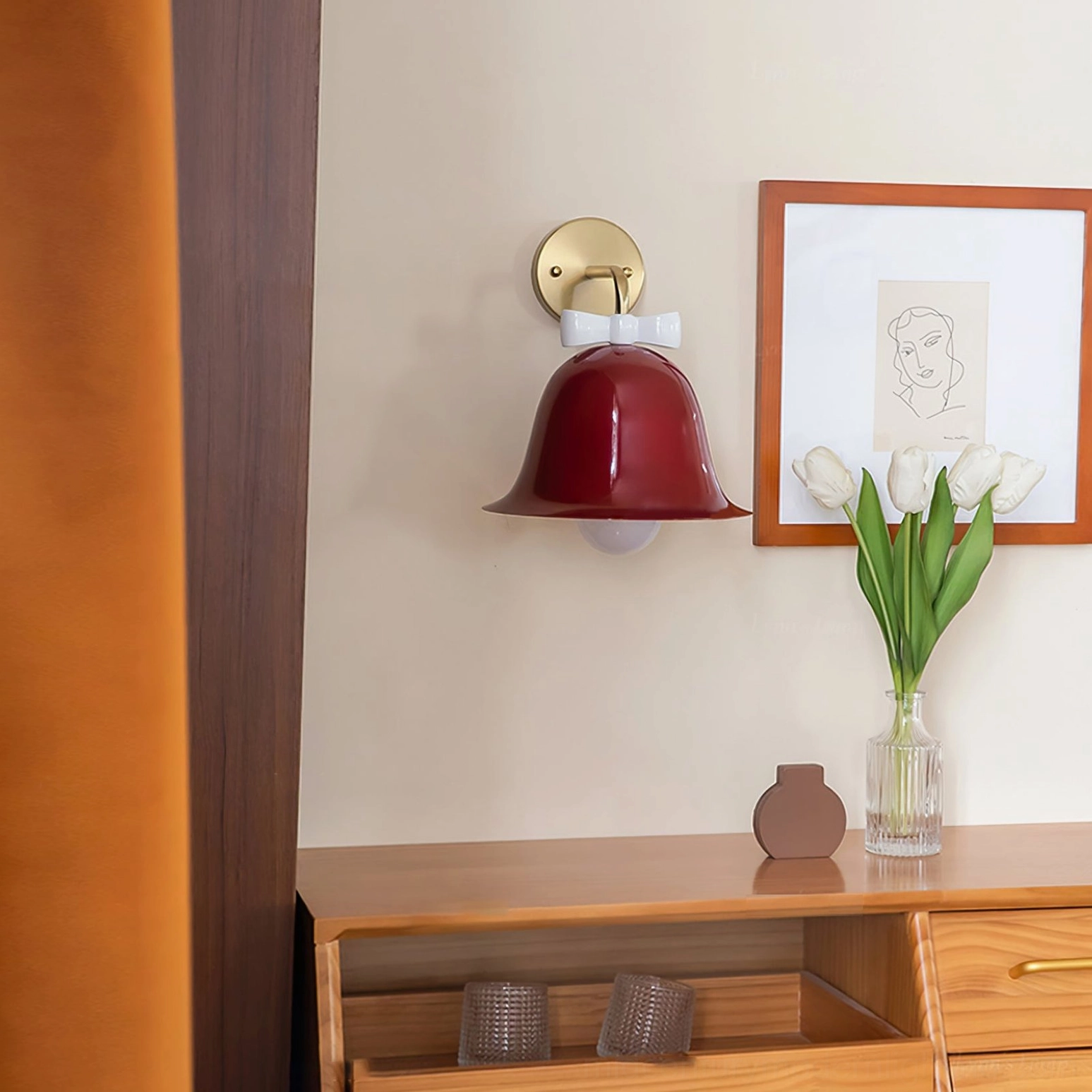 Burgundy Bow Bell Wall Lamp illuminating home desk with tulip flowers in retro interior