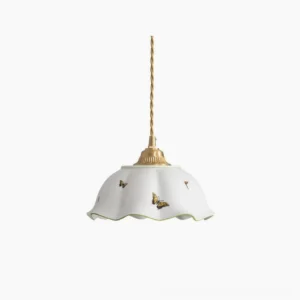 Butterfly ceramic pendant lamp with scalloped white shade and brass hardware on pure white background, front view