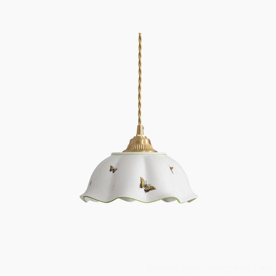 Butterfly ceramic pendant lamp with scalloped white shade and brass hardware on pure white background, front view