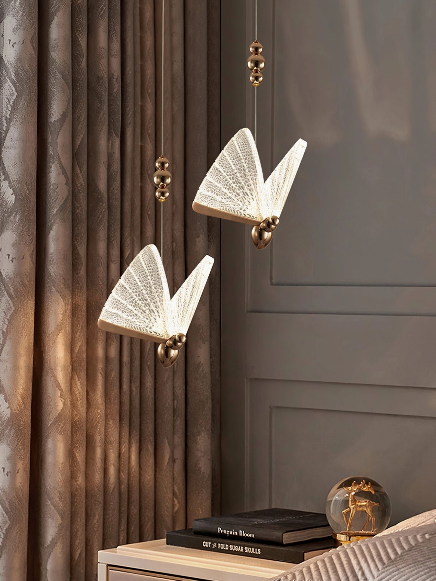Butterfly pendant light brass metallic finish close-up