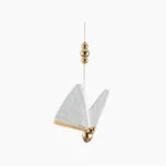 Butterfly pendant light with translucent acrylic wings and gold metal frame in frontal studio view