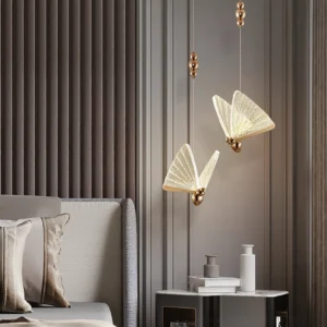 Multiple butterfly pendant lights installed in modern bedroom with warm glow and striped accent wall