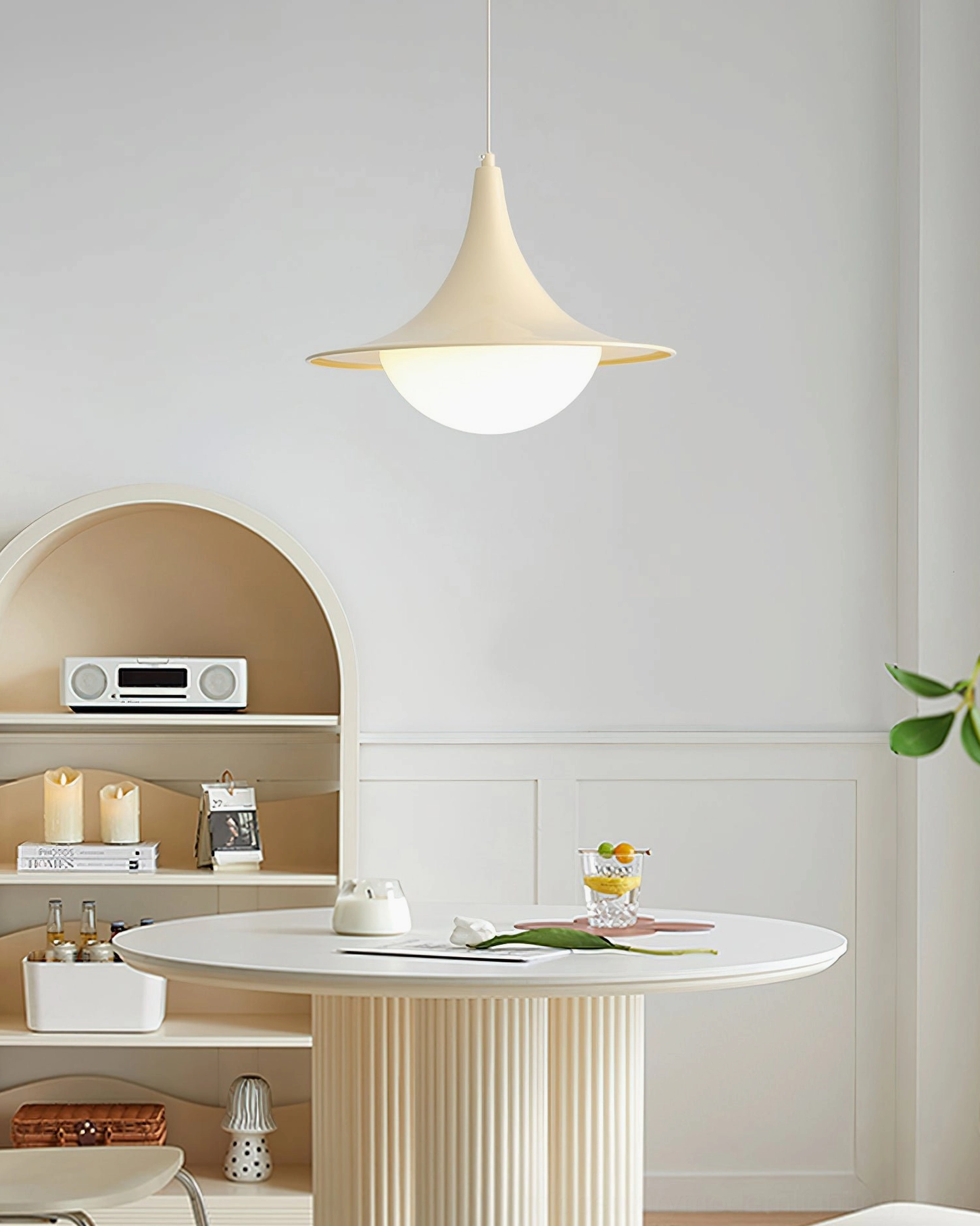 Cabana Pendant Light cream finish trumpet-shaped pendant in warm minimalist dining area, soft diffused lighting