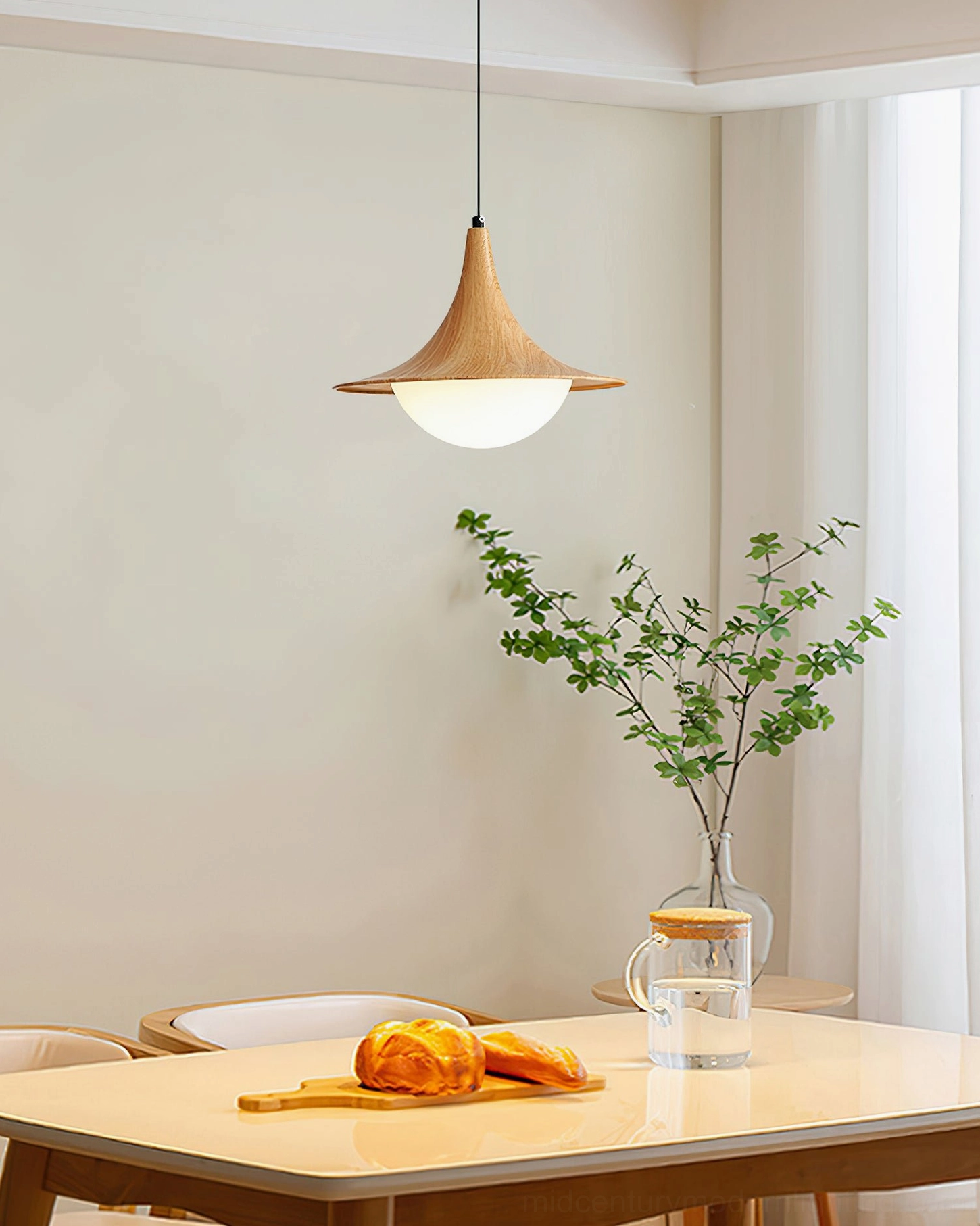Cabana Pendant Light natural wood finish single pendant in cozy dining nook, frosted glass diffuser