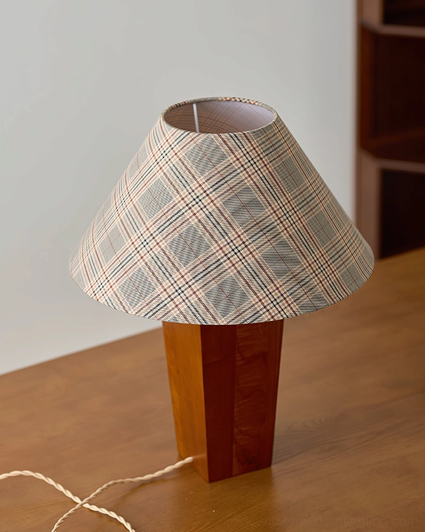 Cabin table lamp front close-up on wooden desk fully assembled with twisted power cord and inline switch