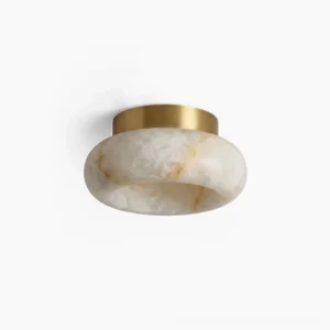 Cairns alabaster flush mount ceiling lamp with solid brass hardware and natural veined stone shade on white studio background
