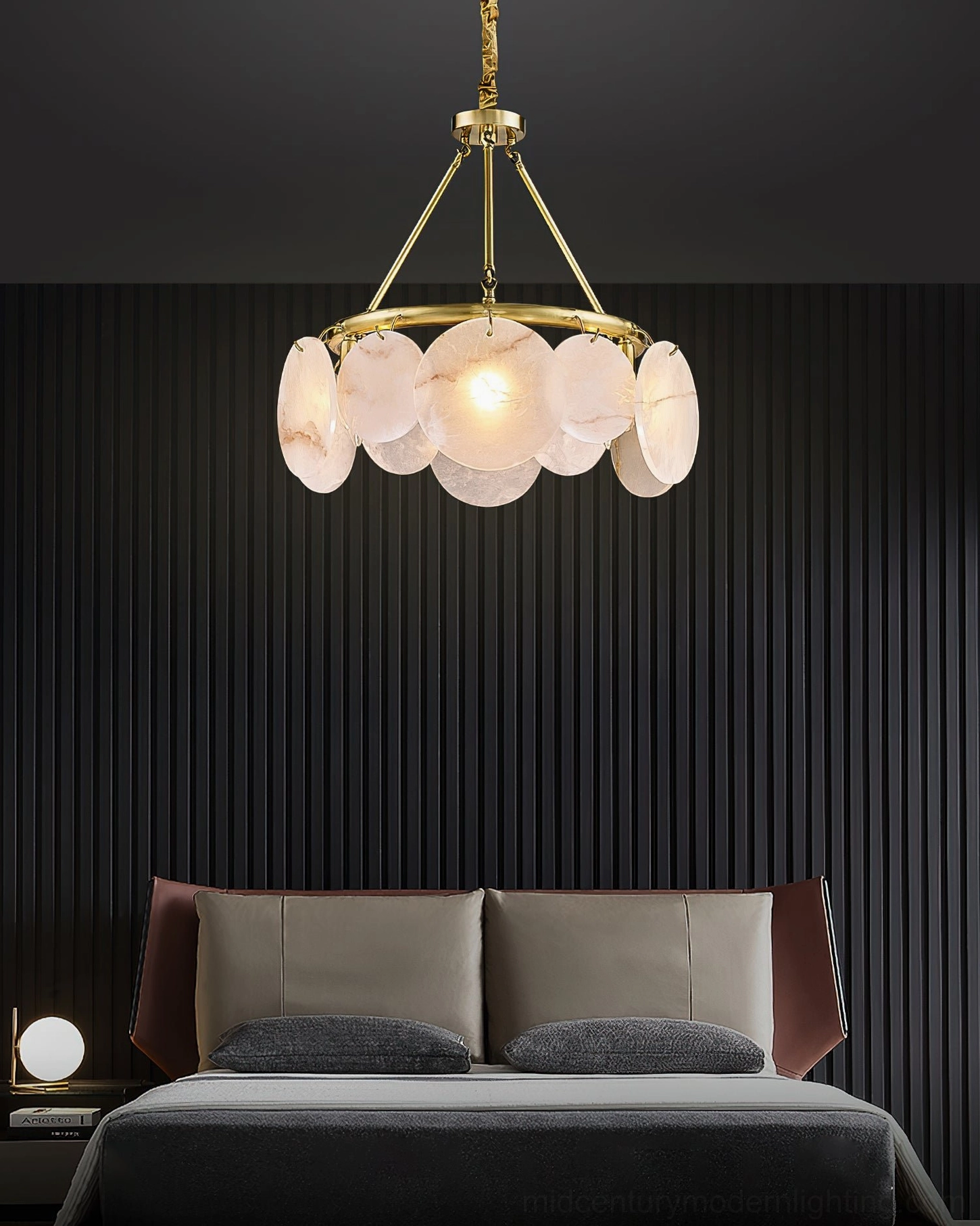 Calamete pendant chandelier in modern bedroom, striped accent wall, upscale bedroom lighting design, organic brass form