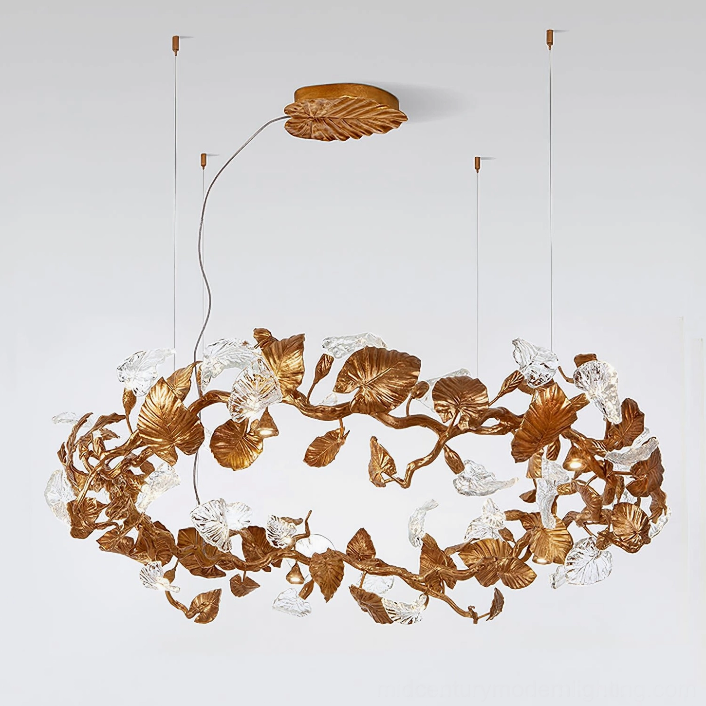 Large elongated Calathea leaf chandelier with dense botanical glass leaf decorations and long circular antique copper ring frame
