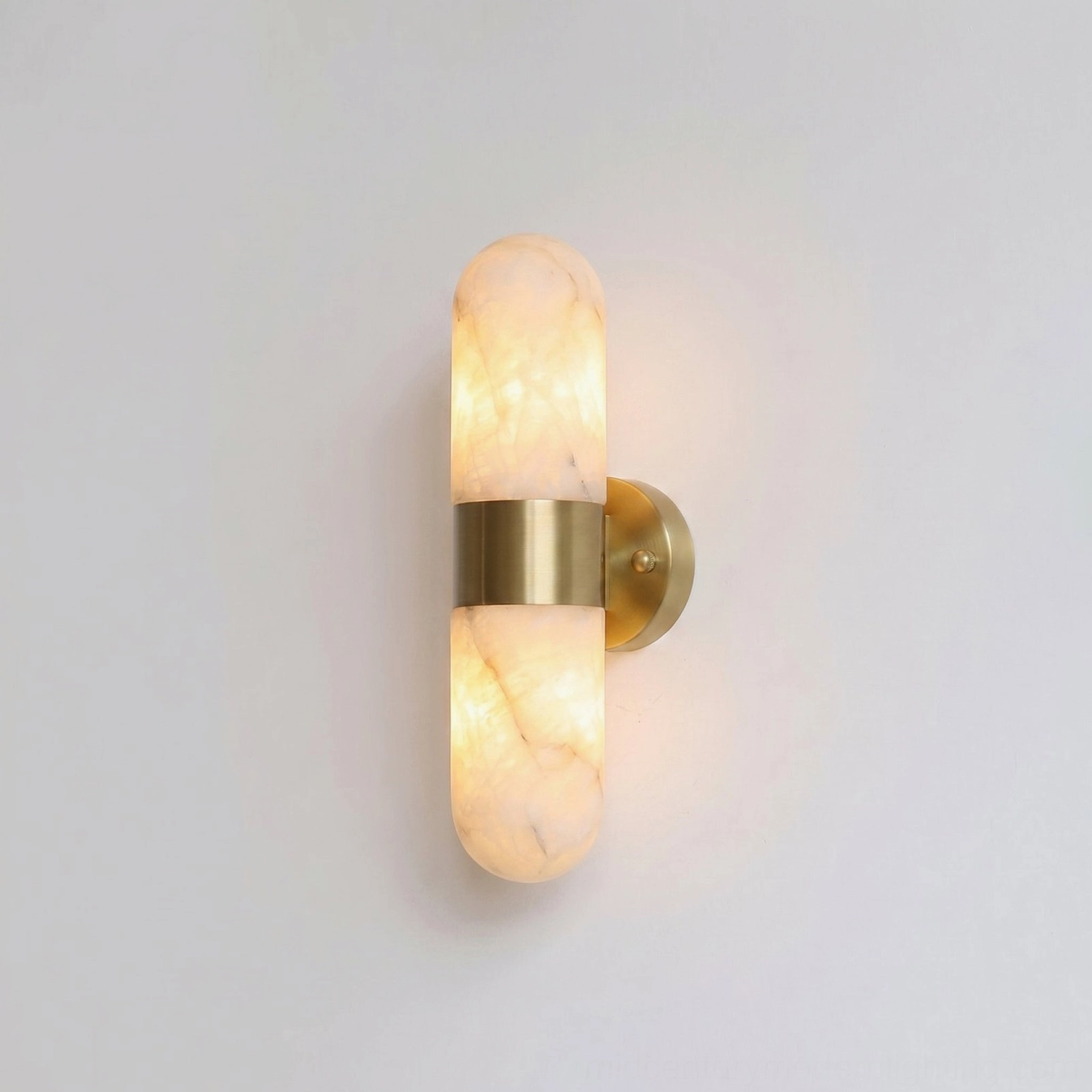 Calla alabaster wall sconce showing stone veining detail, natural translucent alabaster texture