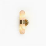 Calla alabaster wall sconce with brushed brass band, studio product photography on neutral background