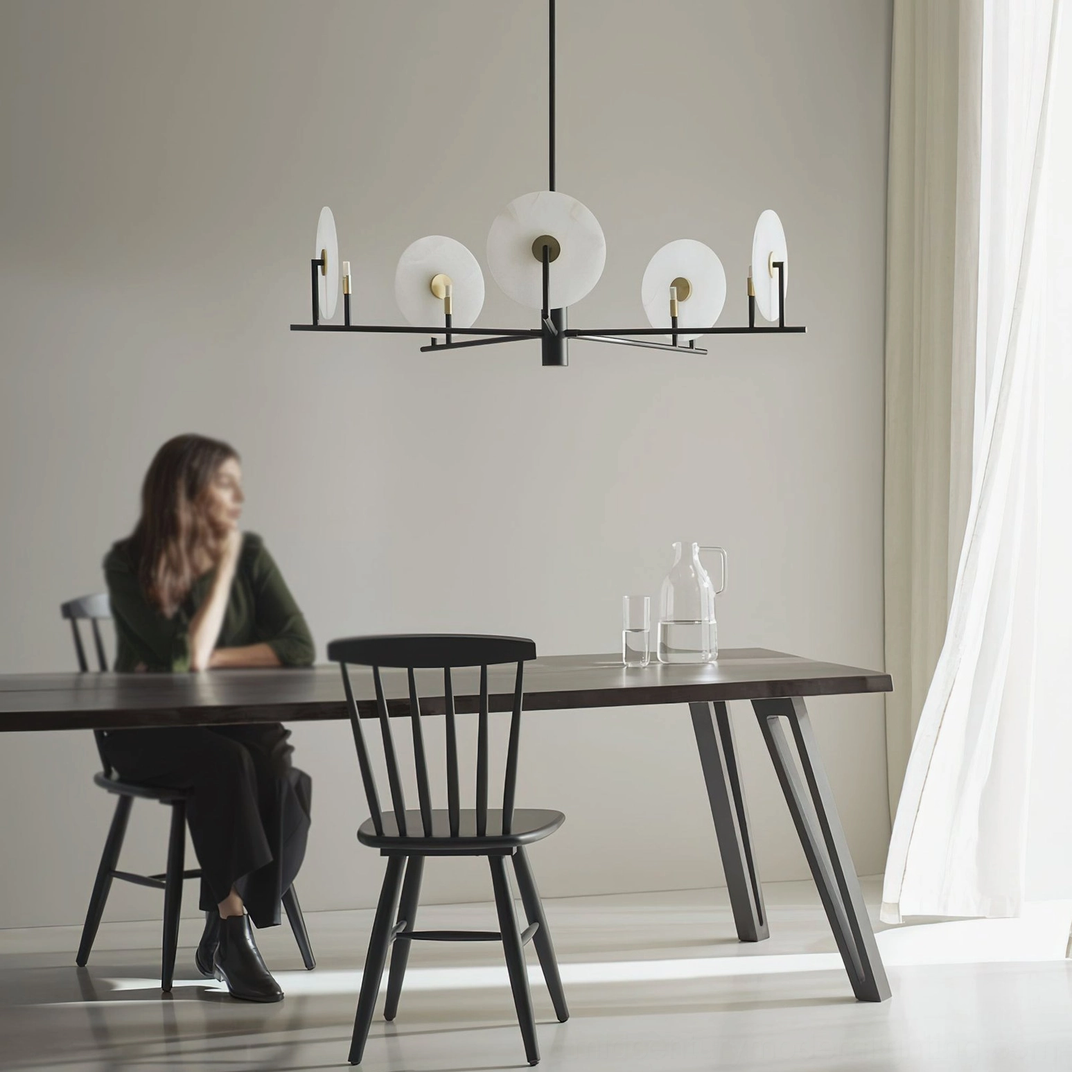 Scandinavian dining space with Callisto alabaster chandelier overhead view from eye level